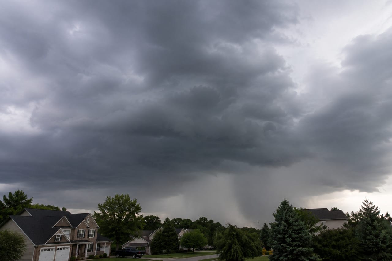 Dark storm clouds and rain moving over an Indianapolis-area neighborhood